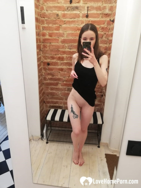 Short brunette takes selfies while stripping & posing sexily in the mirror