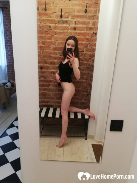 Short brunette takes selfies while stripping & posing sexily in the mirror