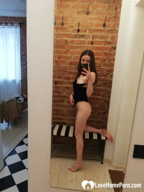 Short brunette takes selfies while stripping & posing sexily in the mirror