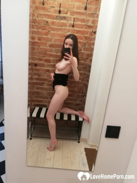 Short brunette takes selfies while stripping & posing sexily in the mirror