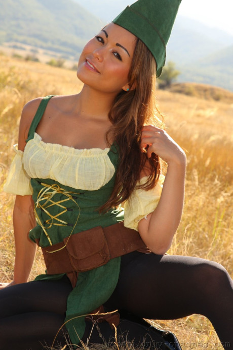 Brunette hottie Lily S reveals her tiny melons in pantyhose in the meadow