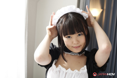 Adorable Japanese maid Ai Mashiro unveils her breasts and undergarment too