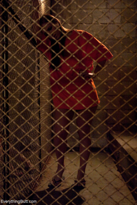 Dirty inmates show their breasts while changing into their prison uniforms