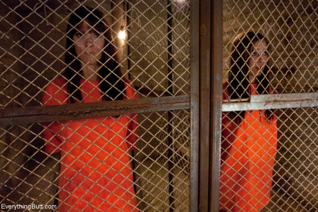 Dirty inmates show their breasts while changing into their prison uniforms