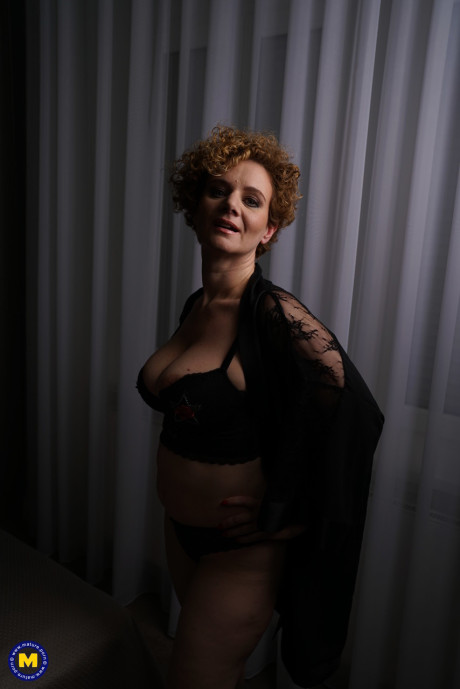Natural ginger head with curly hair licks a kiss after wetting her pussy in bathtub