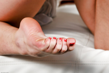 Barefoot first timer Beryl flashing her furry twat while giving handjob