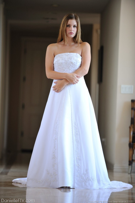 Busty glamorous amateur Danielle models wedding gown indoors & by the pool